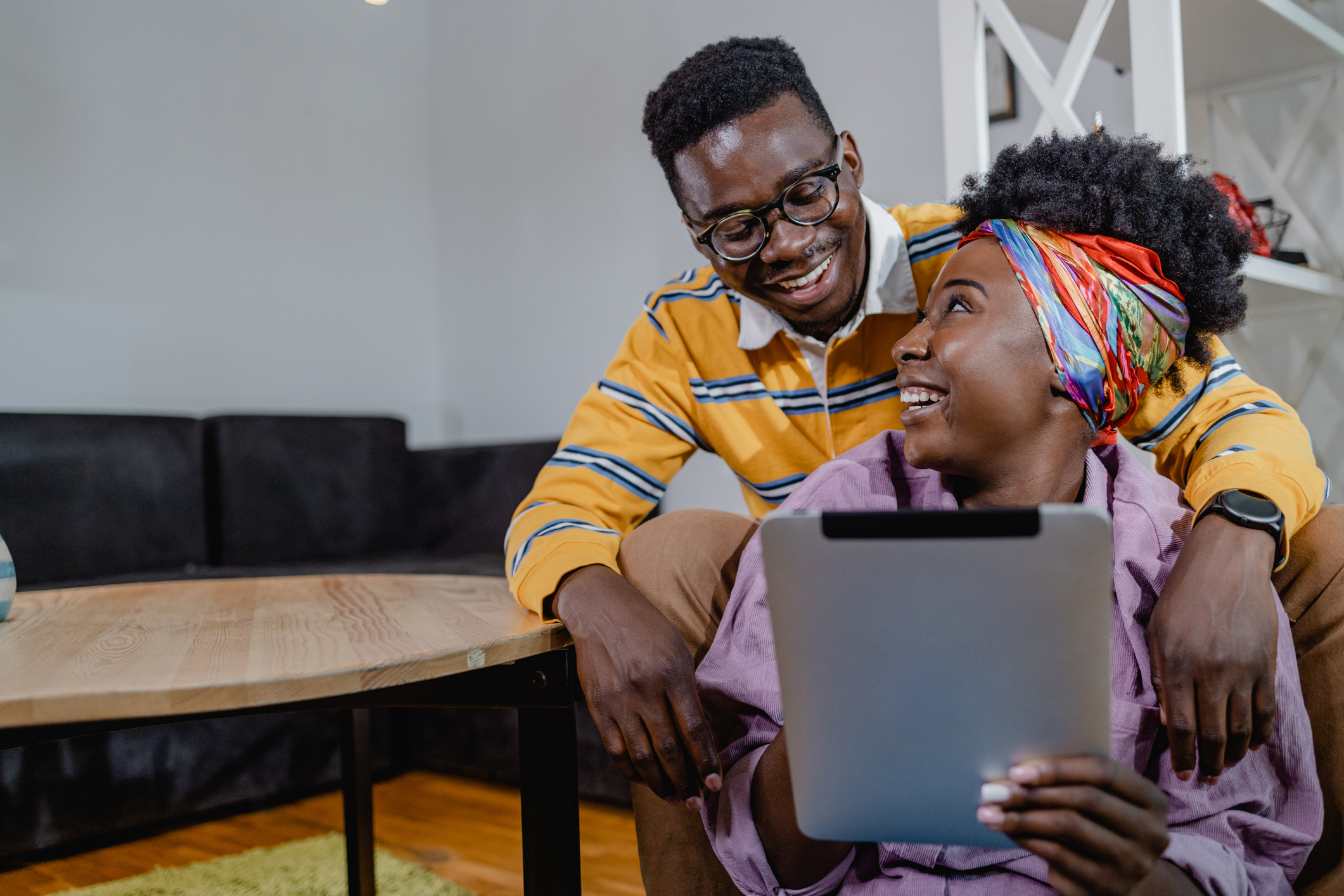 Young couple surfing the internet on a digital tablet
